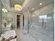 Spa-like bathroom with soaking tub and large walk-in shower at 10193 Brocksport Cir, Gotha, FL 34734
