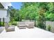 Relaxing poolside patio with wicker furniture at 10193 Brocksport Cir, Gotha, FL 34734