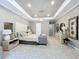 Luxurious main bedroom with plush carpeting and seating area at 10193 Brocksport Cir, Gotha, FL 34734