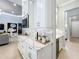 Butler's pantry with white cabinets and quartz countertops at 10193 Brocksport Cir, Gotha, FL 34734