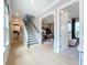 Elegant staircase with dark wood railings leading to the upper level at 10193 Brocksport Cir, Gotha, FL 34734