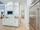 Modern kitchen with white cabinets, stainless steel appliances, and quartz countertops at 10193 Brocksport Cir, Gotha, FL 34734