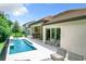 Modern pool and patio with outdoor seating at 10193 Brocksport Cir, Gotha, FL 34734