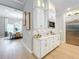 White kitchen cabinets, quartz countertops, and stainless steel appliances at 10193 Brocksport Cir, Gotha, FL 34734