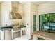 Stainless steel appliances and granite countertops highlight this outdoor kitchen at 10193 Brocksport Cir, Gotha, FL 34734
