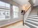 Stunning staircase with dark wood and white risers at 10193 Brocksport Cir, Gotha, FL 34734