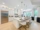 Spacious kitchen with island, white cabinets, and quartz countertops at 10193 Brocksport Cir, Gotha, FL 34734