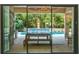Enjoy this relaxing pool area, complete with a spacious patio and outdoor kitchen at 10193 Brocksport Cir, Gotha, FL 34734