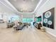 Spacious living room with large sectional sofa and modern artwork at 10193 Brocksport Cir, Gotha, FL 34734
