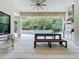 Outdoor kitchen with built-in grill and seating area overlooking pool at 10193 Brocksport Cir, Gotha, FL 34734