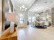 Formal dining room with round table and statement wall at 10193 Brocksport Cir, Gotha, FL 34734