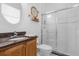Clean bathroom with granite vanity, tiled shower, and a large mirror at 277 Olivia Rose Ct, Lake Mary, FL 32746