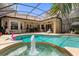 Relaxing pool and spa area with a screened enclosure at 277 Olivia Rose Ct, Lake Mary, FL 32746