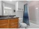 Clean bathroom with wood cabinets, granite countertop, and a tub shower combo at 277 Olivia Rose Ct, Lake Mary, FL 32746