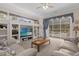 Bright living room with built-in shelving, a pool view, and sliding glass doors at 277 Olivia Rose Ct, Lake Mary, FL 32746