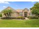 House exterior with landscaping and a fountain at 277 Olivia Rose Ct, Lake Mary, FL 32746