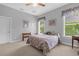 Comfortable bedroom with two windows, neutral walls, and carpeted floors at 277 Olivia Rose Ct, Lake Mary, FL 32746