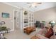 Home office with built-in shelving and comfortable seating at 277 Olivia Rose Ct, Lake Mary, FL 32746