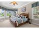Spacious main bedroom with large windows offering garden views and a luxurious feel at 277 Olivia Rose Ct, Lake Mary, FL 32746