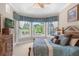 Main bedroom with pool and garden views from bay windows at 277 Olivia Rose Ct, Lake Mary, FL 32746