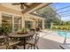 Relaxing pool area with patio furniture and a screened enclosure at 277 Olivia Rose Ct, Lake Mary, FL 32746