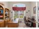 Home office with built-in bookshelves and a large desk at 277 Olivia Rose Ct, Lake Mary, FL 32746