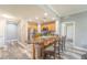 Modern kitchen with granite island and wood cabinets at 7673 Heritage Crossing Way # 101, Reunion, FL 34747