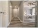 Hallway with wood-look flooring, leading to bedrooms and closets at 7673 Heritage Crossing Way # 101, Reunion, FL 34747