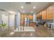 Modern kitchen with granite countertops and stainless steel appliances at 7673 Heritage Crossing Way # 101, Reunion, FL 34747