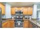 Kitchen with stainless steel appliances and granite counters at 7673 Heritage Crossing Way # 101, Reunion, FL 34747