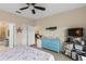Bedroom with ensuite access, dresser, and bookshelves at 2877 Attwater Loop, Winter Haven, FL 33884
