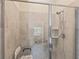 Walk-in shower with grab bars and tiled walls at 2877 Attwater Loop, Winter Haven, FL 33884