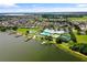 Community overview featuring lake, clubhouse, and homes at 2877 Attwater Loop, Winter Haven, FL 33884