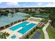 Resort-style pool, spa, and clubhouse with tennis courts at 2877 Attwater Loop, Winter Haven, FL 33884