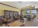 Relaxing library with comfortable seating, large bookshelves, and a view at 2877 Attwater Loop, Winter Haven, FL 33884