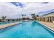 Large, inviting community pool with lounge area at 2877 Attwater Loop, Winter Haven, FL 33884