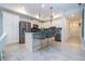 Modern kitchen with white shaker cabinets, stainless steel appliances, and an island at 3191 Paradox Cir # 102, Kissimmee, FL 34746