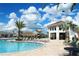 Resort-style pool with lounge chairs and a bar at 3191 Paradox Cir # 102, Kissimmee, FL 34746