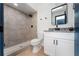 Modern bathroom with gray tile shower and white vanity at 538 Windmeadows St, Altamonte Springs, FL 32701