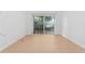Light-filled bedroom with wood-look flooring and a large window at 538 Windmeadows St, Altamonte Springs, FL 32701
