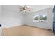 Simple bedroom with light walls, wood-look floors and ceiling fan at 538 Windmeadows St, Altamonte Springs, FL 32701