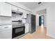 Updated kitchen featuring stainless steel appliances and light wood flooring at 538 Windmeadows St, Altamonte Springs, FL 32701