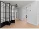 Open living area with a room divider and wood-look floors at 538 Windmeadows St, Altamonte Springs, FL 32701