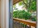 Private patio with wooden railings and lush green backyard views at 538 Windmeadows St, Altamonte Springs, FL 32701