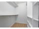 Bright walk-in closet with ample shelving and wood flooring at 538 Windmeadows St, Altamonte Springs, FL 32701