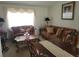 Living room with brown sofas, coffee table, and decorative pillows at 713 W 2Nd St, Lakeland, FL 33805