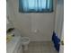 Clean bathroom with a toilet, sink, and shower at 713 W 2Nd St, Lakeland, FL 33805