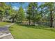 Paved walkway winds through lush green landscape at 700 Melrose Ave # K32, Winter Park, FL 32789