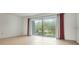 Bright bedroom with wood-look floors and access to balcony at 700 Melrose Ave # K32, Winter Park, FL 32789
