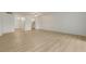 Spacious living room with wood-look floors and an open floor plan at 700 Melrose Ave # K32, Winter Park, FL 32789